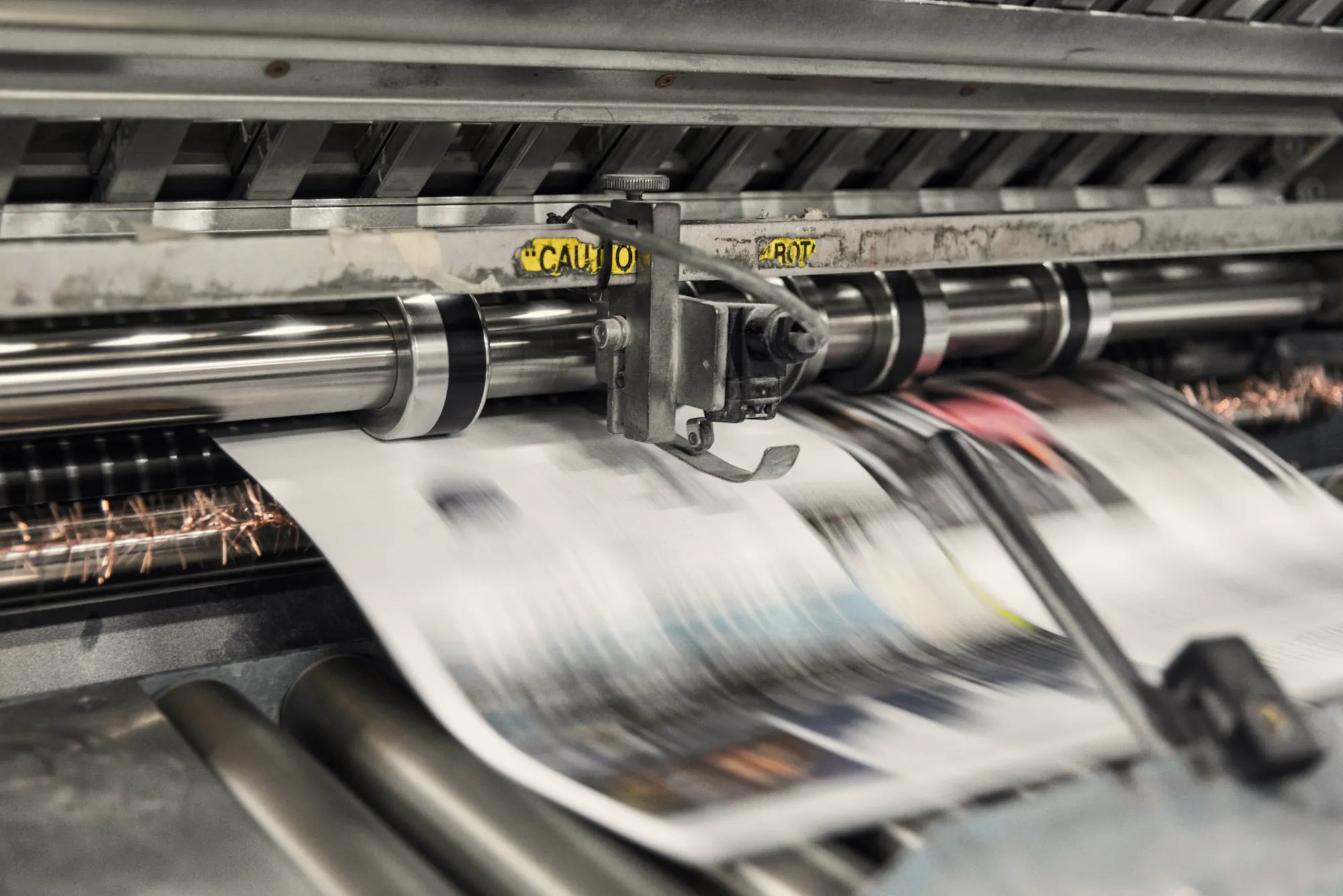 Newspapers on a printing press